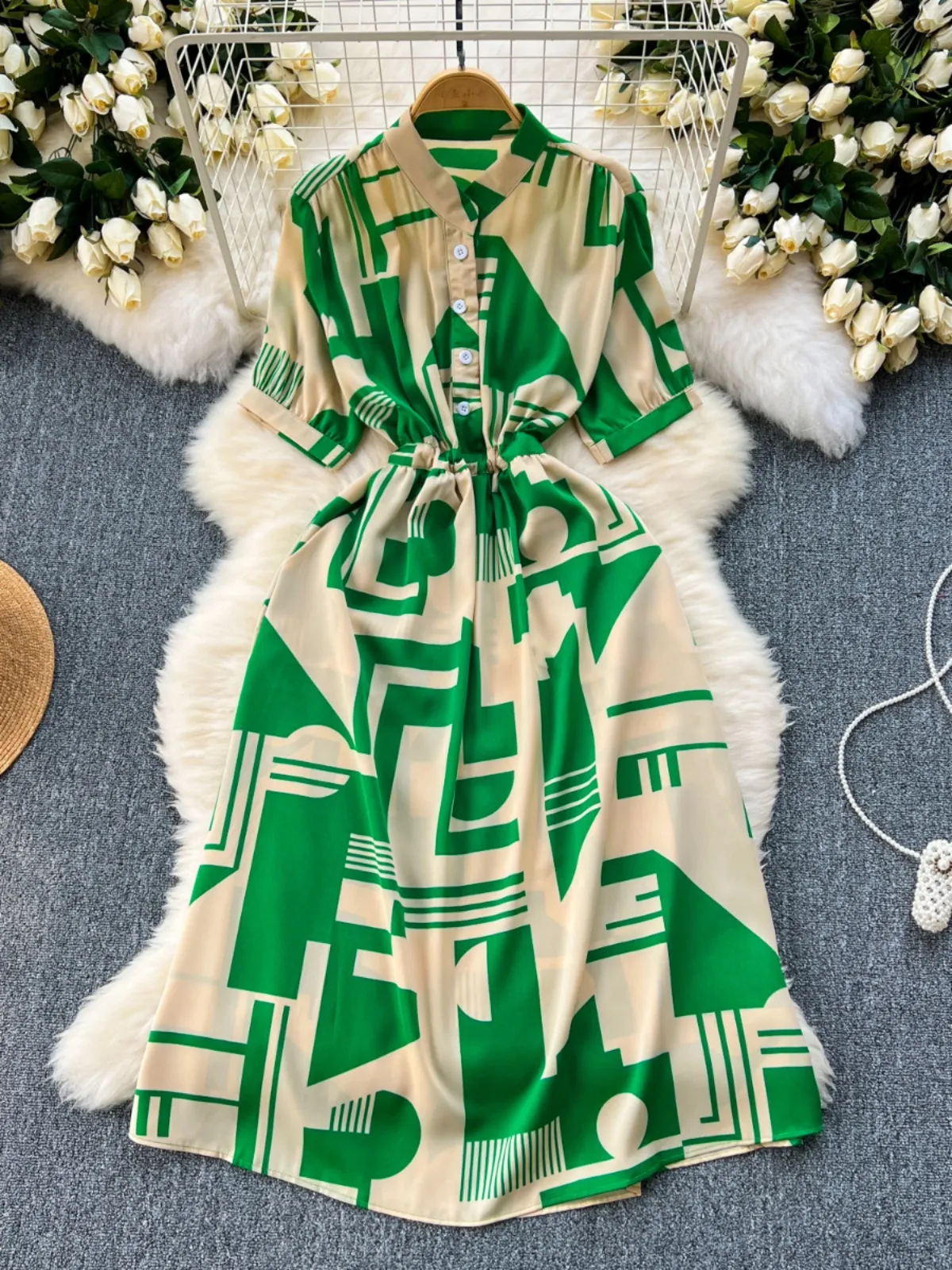 A niche design inspired print dress for women's 2024 new summer dress with tie up waist for slimming effect. Mid length vacation dress