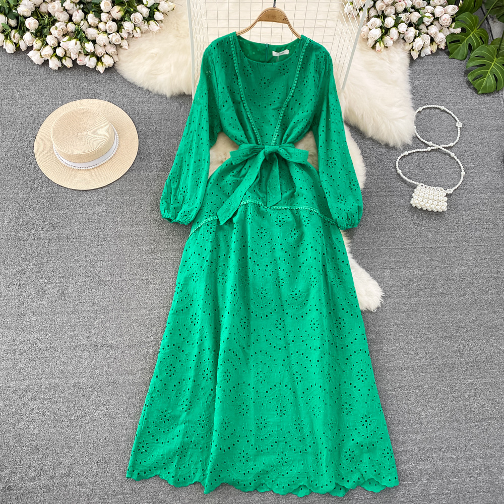 Beach resort long dress with a gentle and retro style, long sleeved round neck, waist cinching, slimming A-line hollow out dress