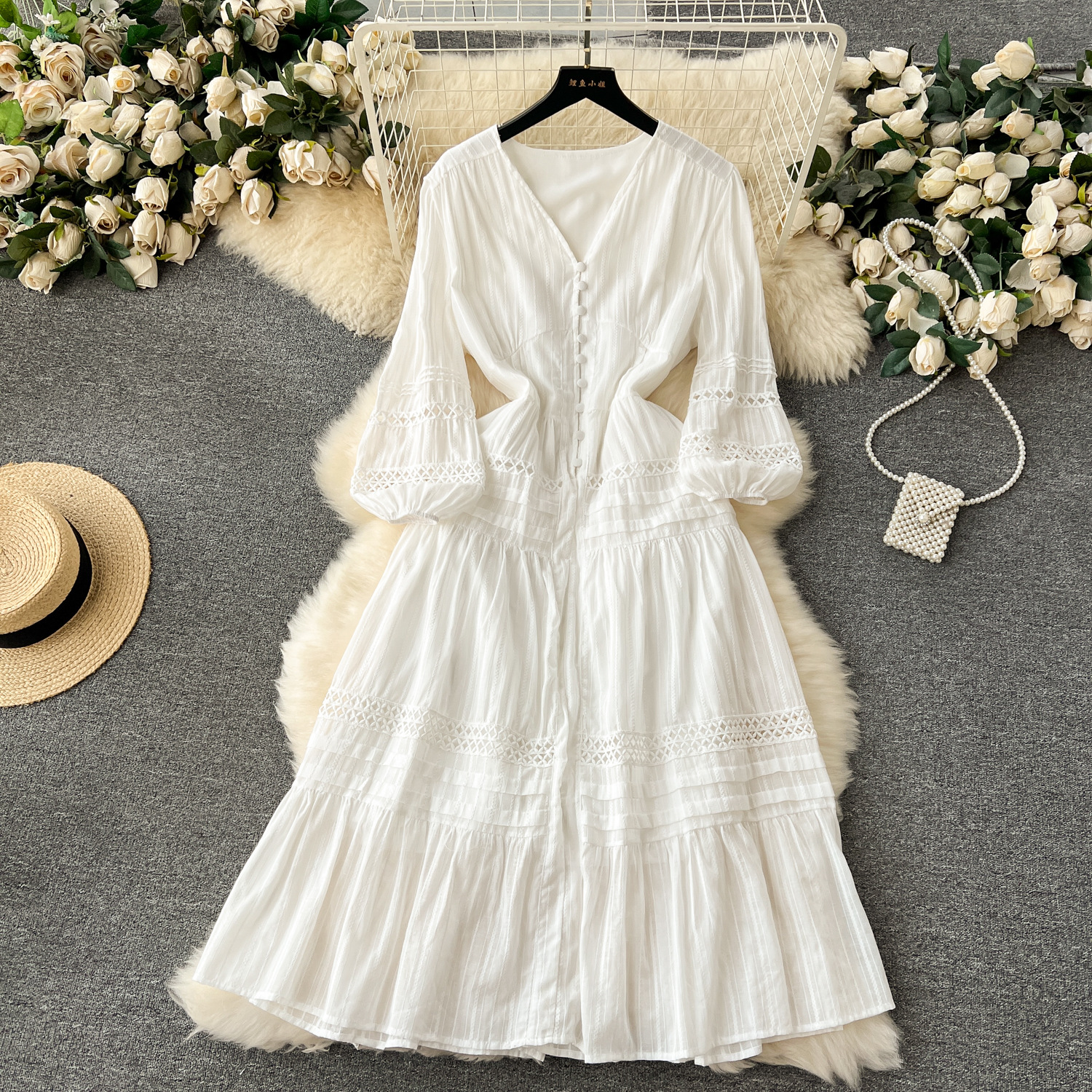 Bohemian vacation style dress design with hollow bubble sleeves, button fit, slim fit, mid length style, elegant dress for women