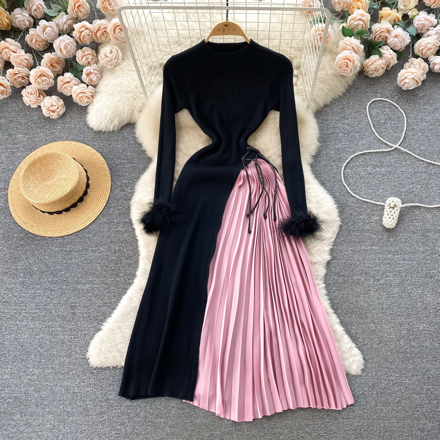 Knitted dress, women's design sense, looped long sleeved, high-end, contrasting color patchwork, pleated skirt, temperament, slim fit, medium length skirt
