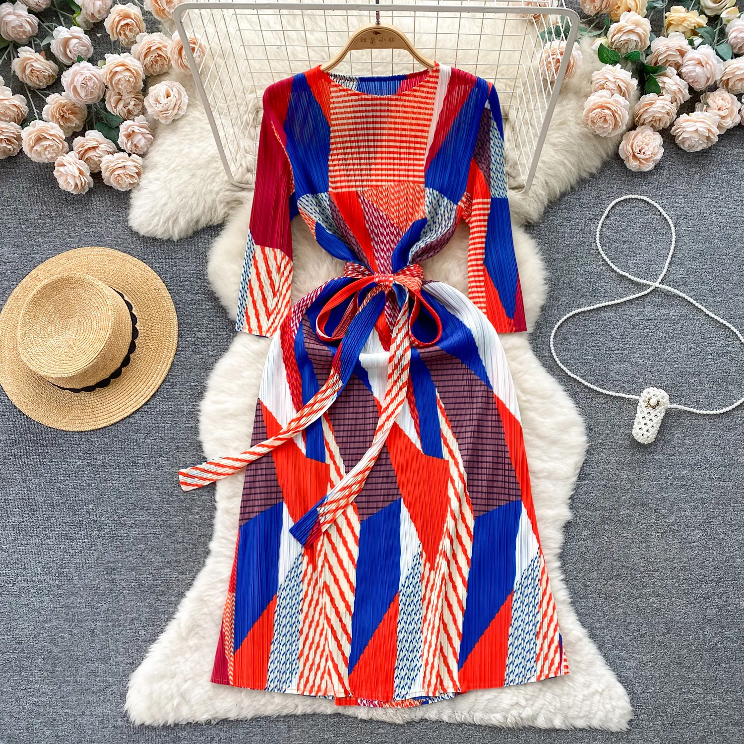 High end three house pleated heavy work pleated design, color blocking printing, slim fit, mid length style, and elegant spring dress