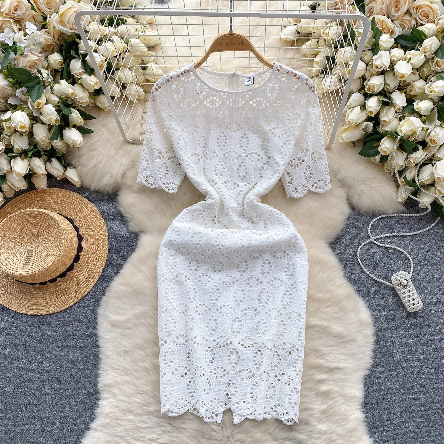 White dress, women's high-end temperament, lace hook flower hollowed out round neck, short sleeved slim fit, buttocks wrapped skirt, women's spring style