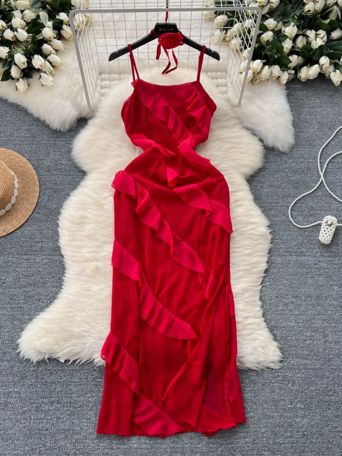 Red mini dress for women on beach vacation, summer outfit with a sense of atmosphere. Goddess style slit ruffle strap dress