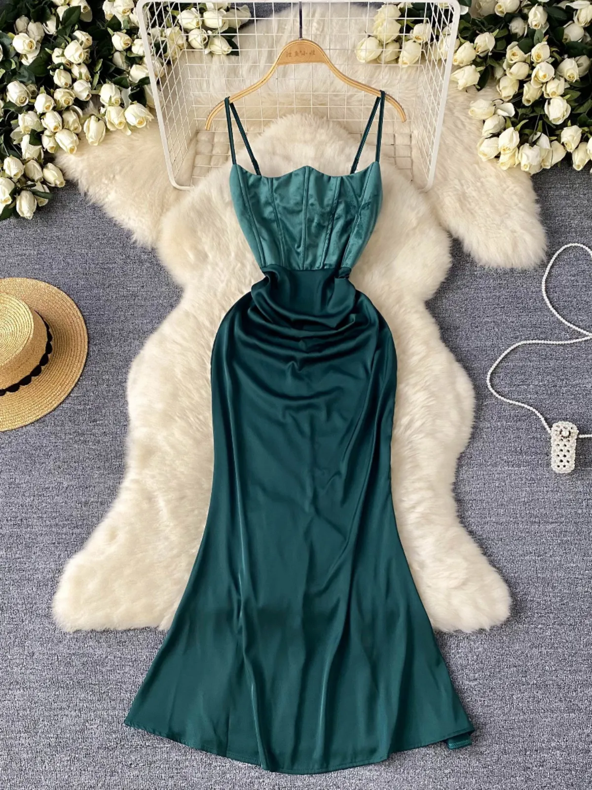 High end formal dress for a female lady wearing a sophisticated and scheming backless fishbone slimming dress with a satin strap for a slim fit