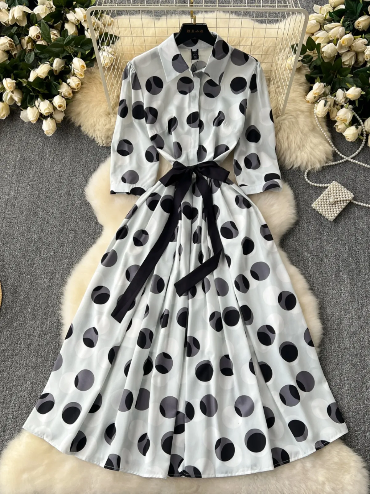 A niche high-end elegant dress for women in 2024 with a new design sense. Tie up waist, large swing, polka dot printed shirt skirt
